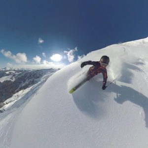 man skiing powder in morzine 