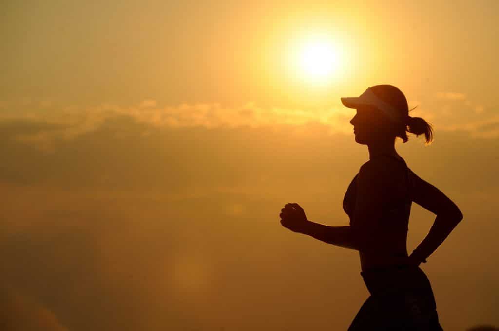 woman running to prepare for your ski holiday