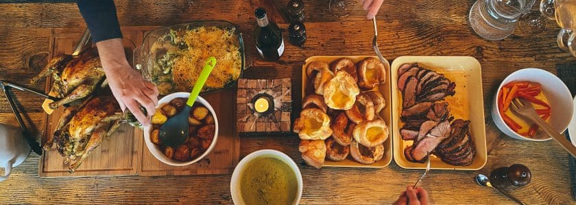 sunday roast shared over wooden table