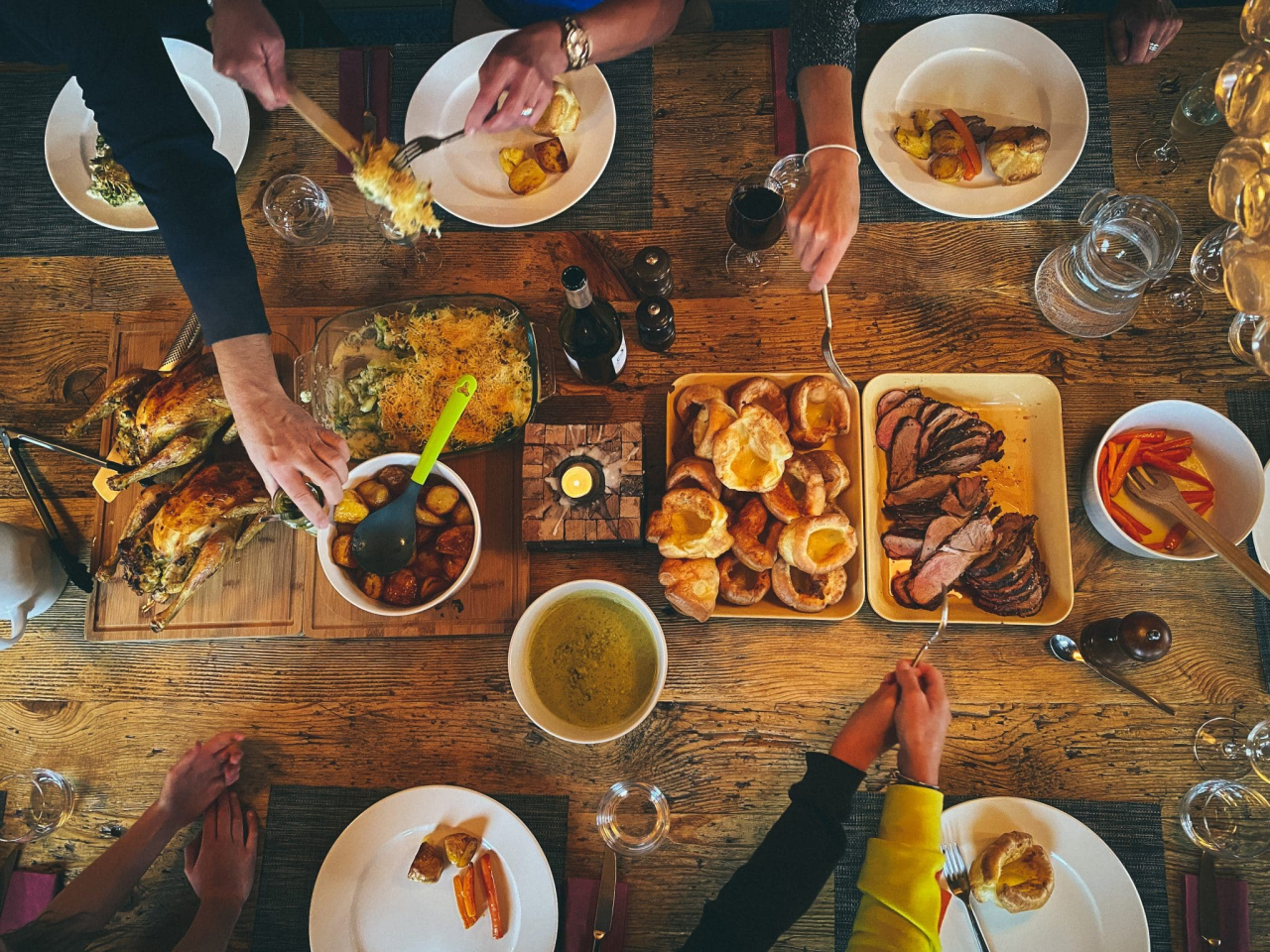 sunday roast shared over wooden table
