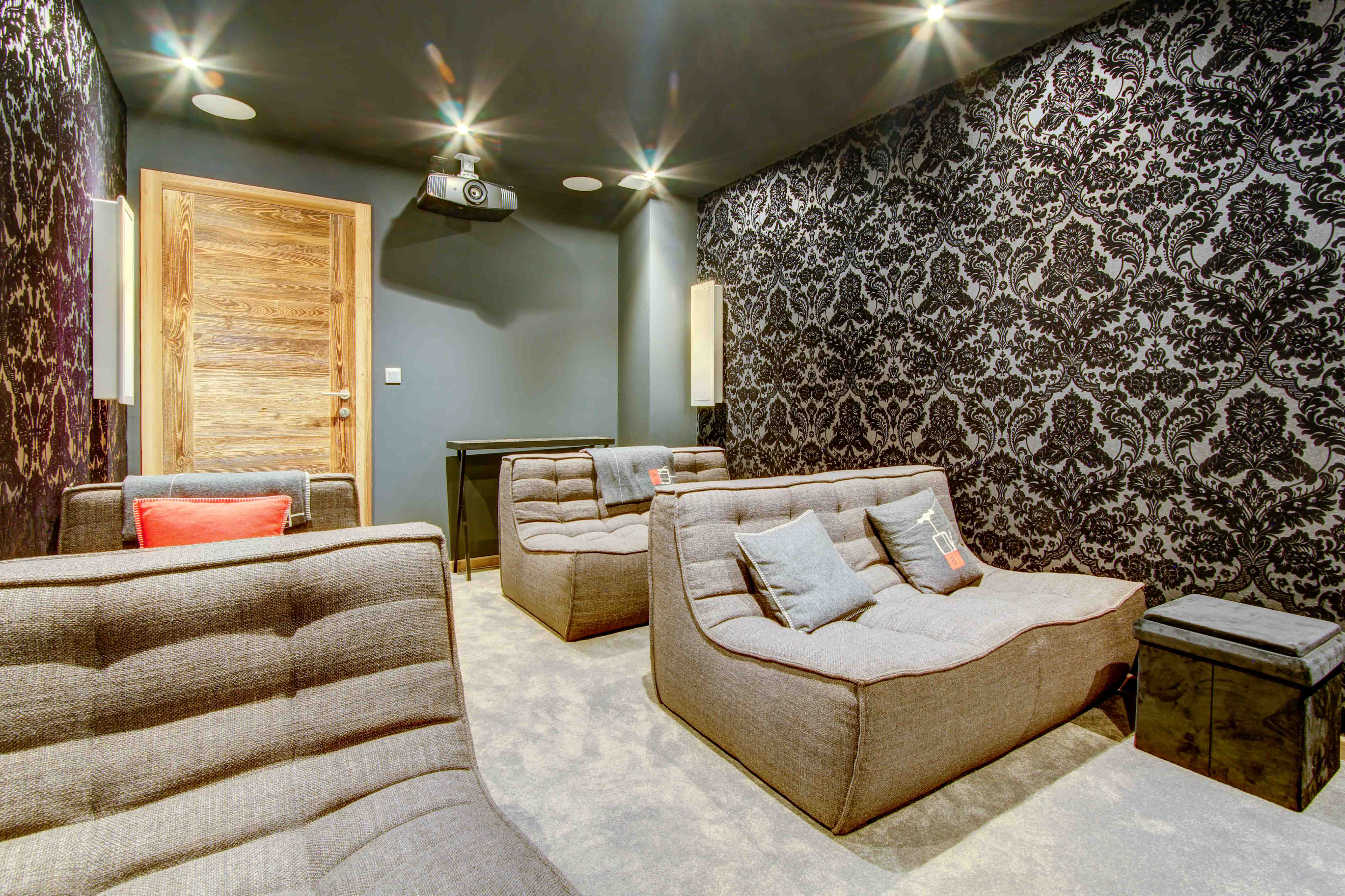 ski chalet in Morzine Comfortable chairs in cinema room with projector