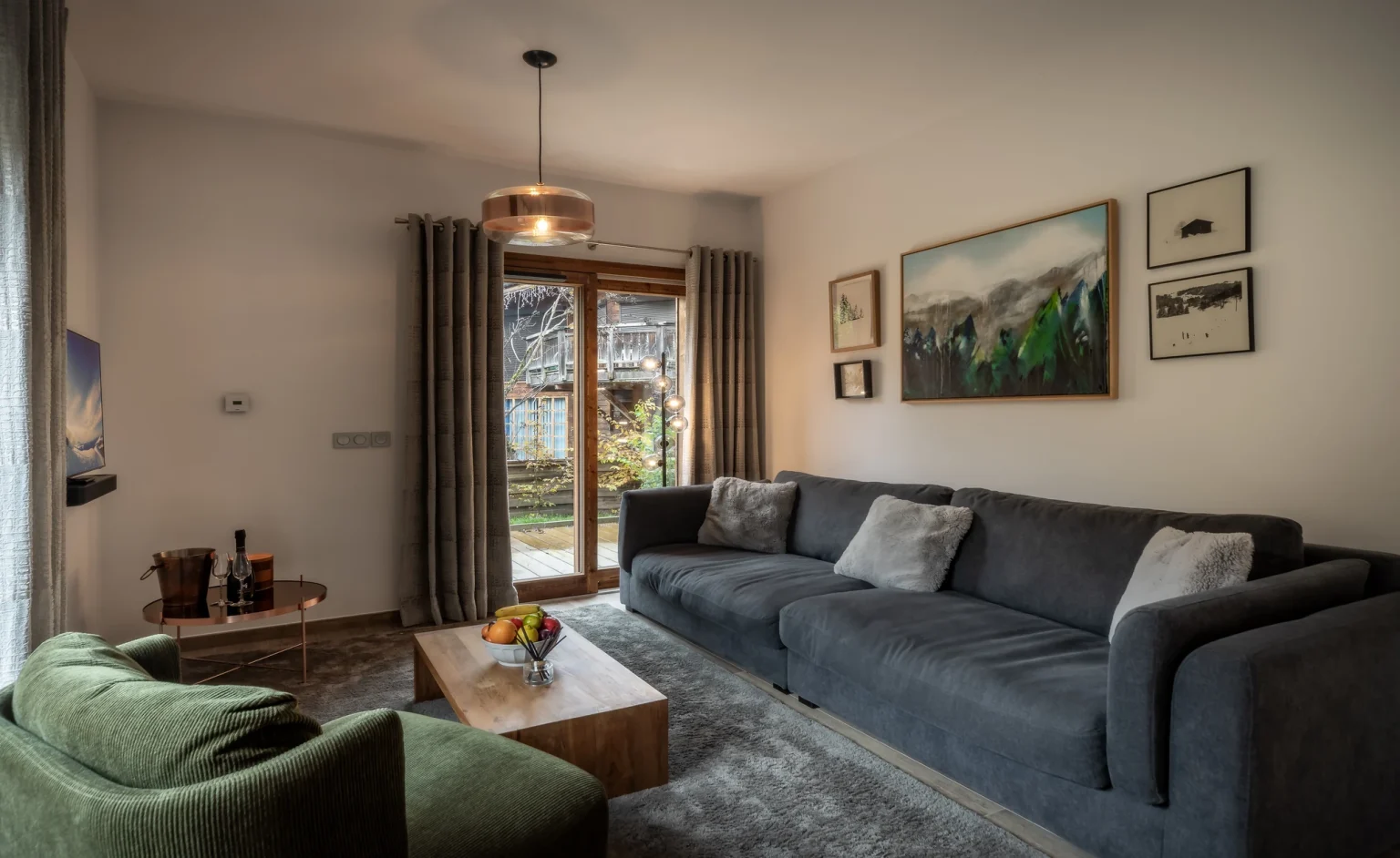 Elevation Alps - Cosmiques - grey sofa with paintings